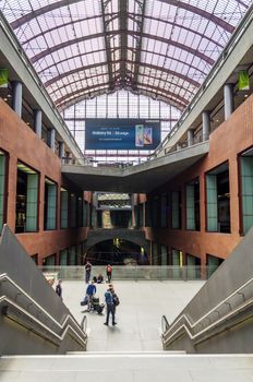 Antwerp, Belgium - May 11, 2015: People in Main hall of Antwerp Central station on May 11, 2015 in Antwerp, Belgium. The station is now widely regarded as the finest example of railway architecture in Belgium.