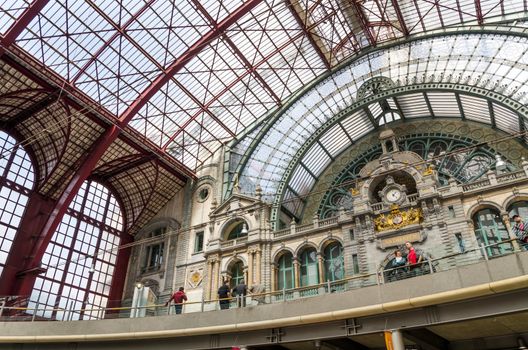 Antwerp, Belgium - May 11, 2015: People in Main hall of Antwerp Central station on May 11, 2015 in Antwerp, Belgium. The station is now widely regarded as the finest example of railway architecture in Belgium.