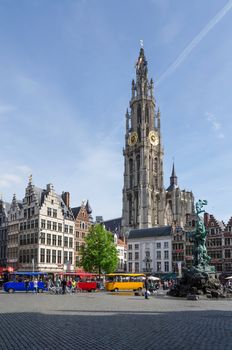 Antwerp, Belgium - May 10, 2015: Tourist visit The Grand Place with the Statue of Brabo, throwing the giant's hand into the Scheldt River and the Cathedral of our Lady. on May 10, 2015 in Antwerp, Belgium. 