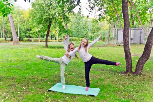 Photo of two playing girls in summer