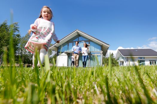 happy family running from the house