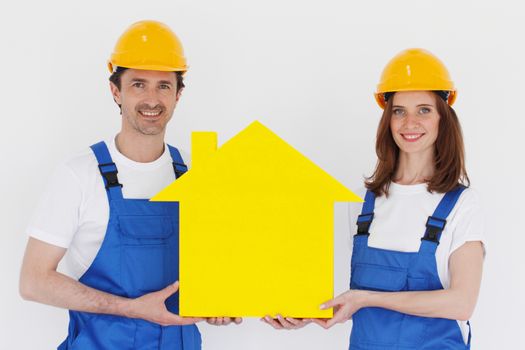 two workmen holding yellow house symbol