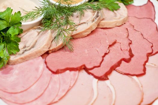 Group of thin sliced meat, ham and sauce
