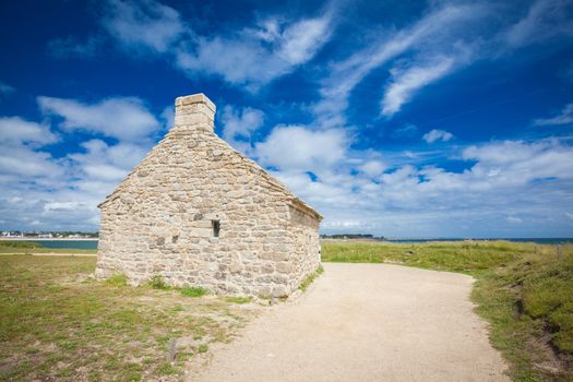 stone house and lighthouse at the mouth of the Odet