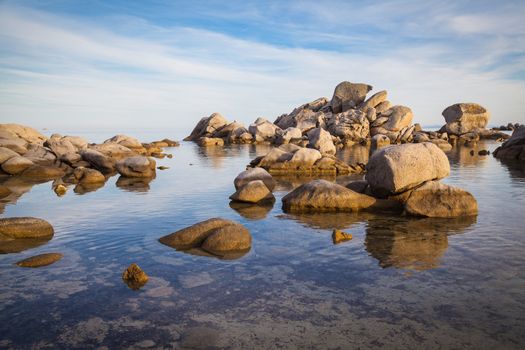 Trees and rocks at the beach of Palombaggia, the most famous beach of Corsica