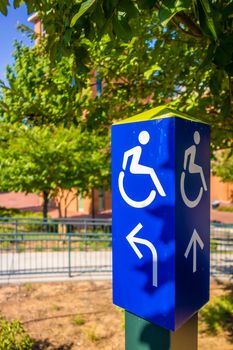 blue handicapped wheel chair post sign