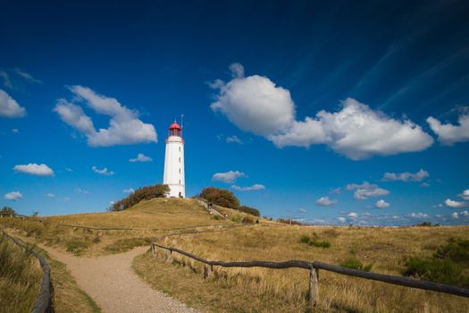 Lighthouse Dornbusch on the island of Hiddensee in blue sky