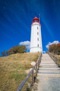 Lighthouse Dornbusch on the island of Hiddensee in blue sky