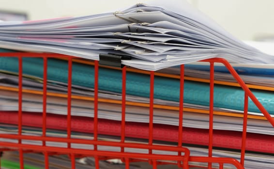 Basket for a documents and files placed on the desk in the room.                               