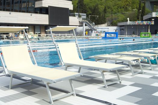 The swimming pool under beams of the sun is ready to competitions and rest