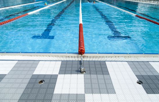 The swimming pool under beams of the sun is ready to competitions and rest