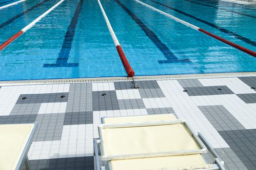 The swimming pool under beams of the sun is ready to competitions and rest