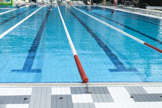 The swimming pool under beams of the sun is ready to competitions and rest