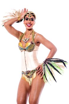 Image of a woman samba dancer posing over white