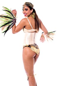 Pretty samba dancer woman looking back over white