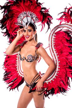 Beautiful carnival dancer in amazing costume over white