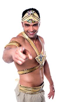 Handsome male samba dancer pointing forward over white