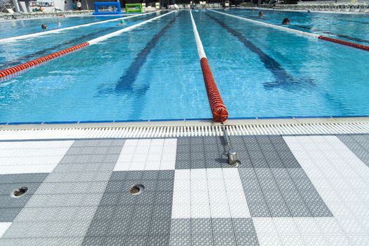 The swimming pool under beams of the sun is ready to competitions and rest