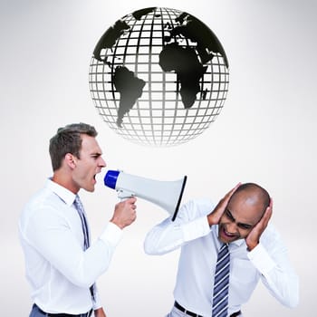 Businessman yelling with a megaphone at his colleague against grey background