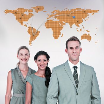 Happy business team smiling at camera  against world map with lines