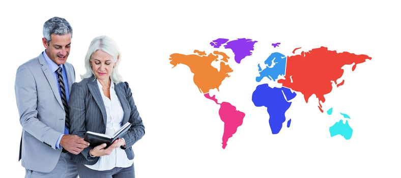  Smiling businesswoman and man with a notebook against colourful world map