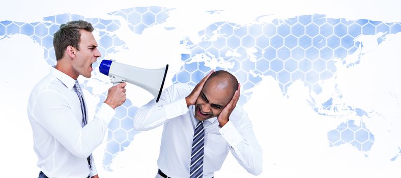 Businessman yelling with a megaphone at his colleague against background with world map