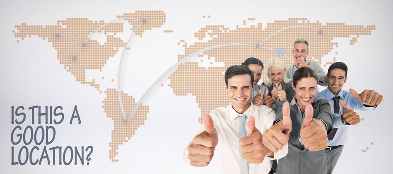 Happy business people looking at camera with thumbs up  against world map with lines