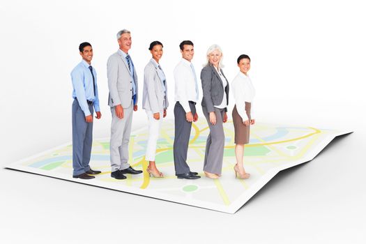 Business people looking at camera  against city map