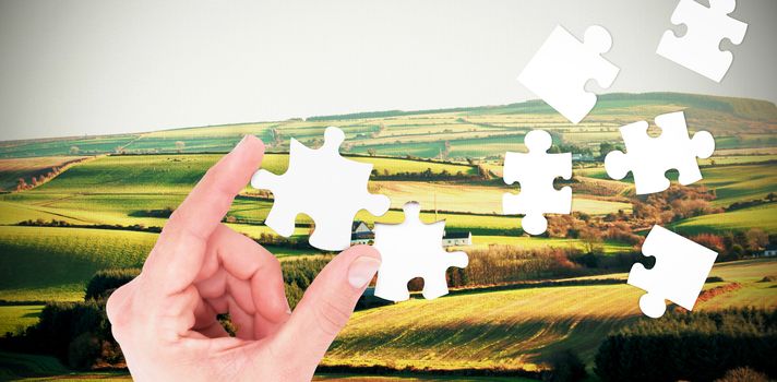 Businessman measuring something with his fingers against scenic landscape