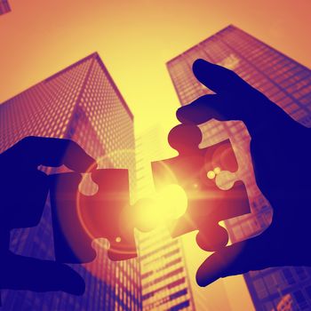 Businessman pointing with his finger against skyscraper