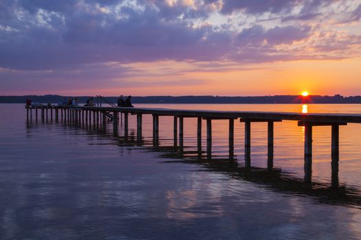 Reflections and jetty at Lake Starnberg  in the evening light