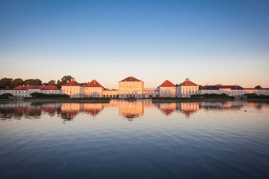 Nymphenburg palace with reflection in the morning sunlight