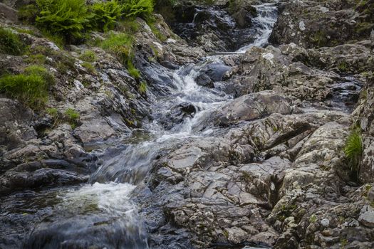 Long Exposure of water flowing down over stones