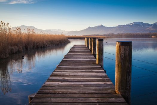 Early morning at a jetty at lake Chiemsee