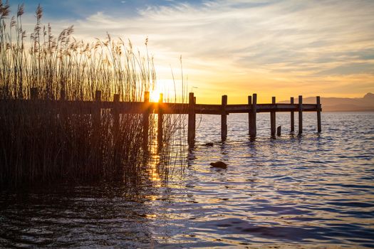 Early morning at a jetty at lake Chiemsee