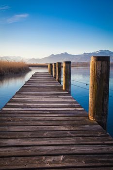 Early morning at a jetty at lake Chiemsee