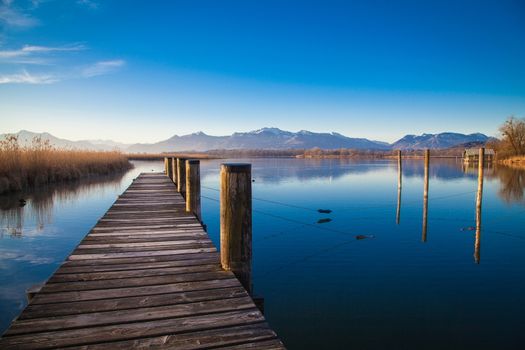 Early morning at a jetty at lake Chiemsee