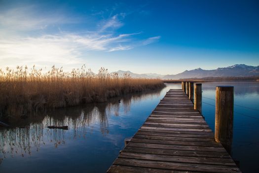 Early morning at a jetty at lake Chiemsee