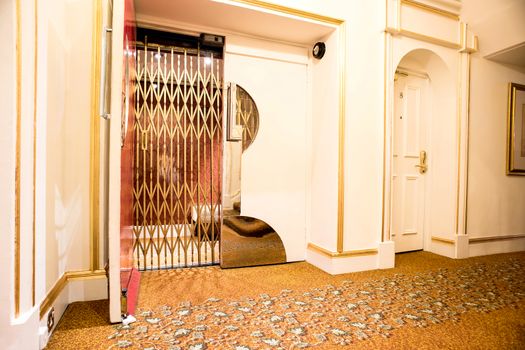 Front view of a elevator with steel door in lobby