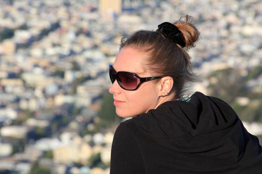 The adult woman on a background of Twin Peaks, San Francisco