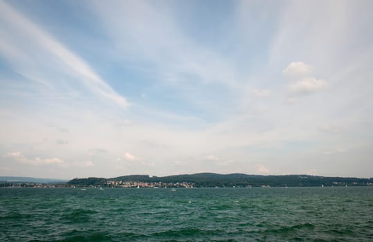 Lake Constance (German: Bodensee) is a lake on the Rhine at the northern foot of the Alps .