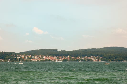 Lake Constance (German: Bodensee) is a lake on the Rhine at the northern foot of the Alps .