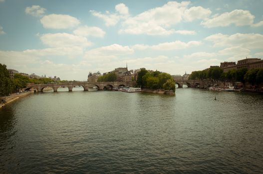 Cite Island and Pont Neuf, the oldest stone bridge across the Seine river in Paris, France