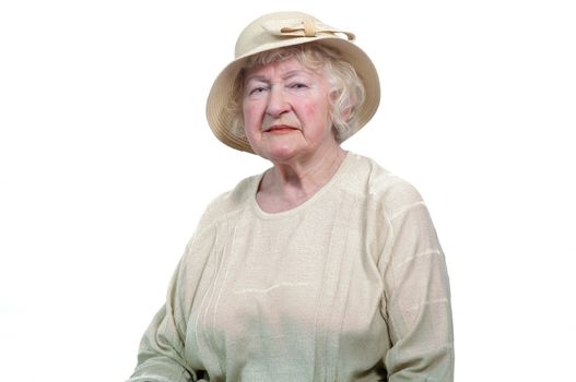 Portrait of  80 years old cheerful woman  on a white background.