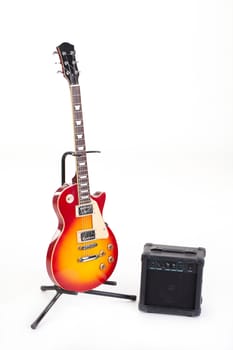 Electric guitar and the amplifier on isolated bckground