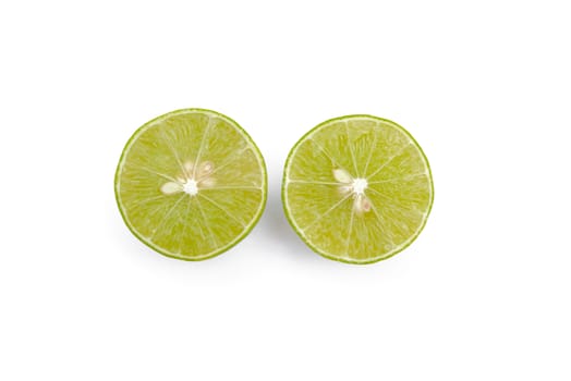 Juicy slices of lime isolated on white background.