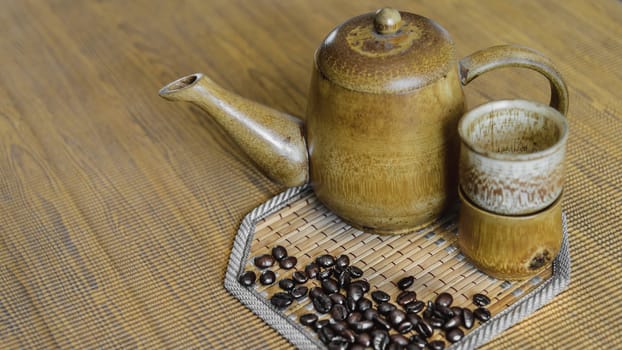 Soft focus image of coffee beans and coffee cups set on wooden background.Vintage style.(soft focus)