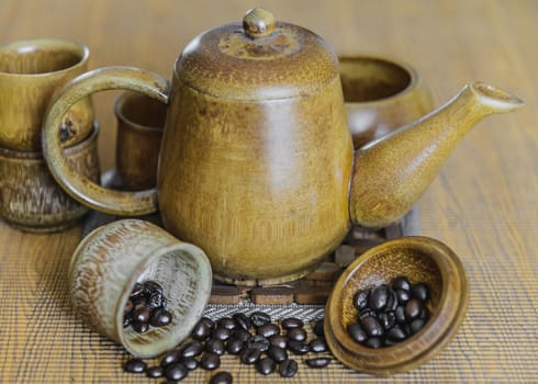 Soft focus image of coffee beans and coffee cups set on wooden background.Vintage style.(soft focus)