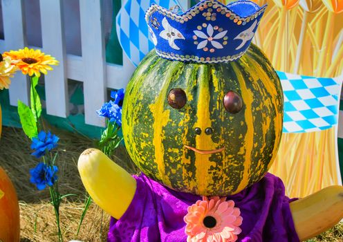 Funny figurine, made from pumpkins, squash, decorative crown.