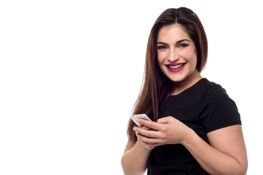 Smiling woman posing with new mobile phone